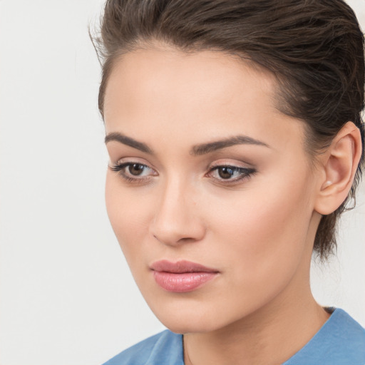 Neutral white young-adult female with medium  brown hair and brown eyes