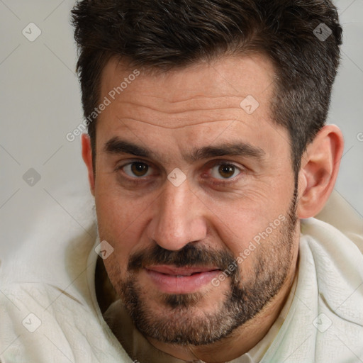 Joyful white adult male with short  brown hair and brown eyes