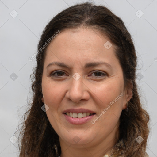 Joyful white adult female with long  brown hair and brown eyes