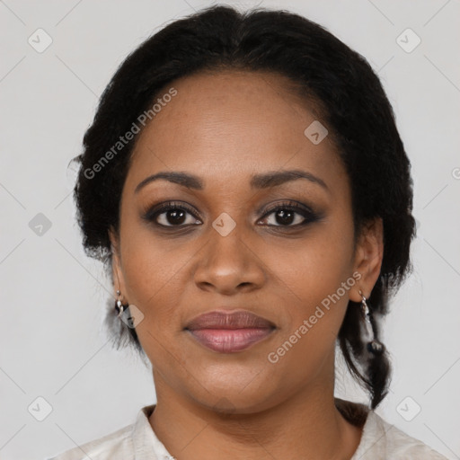 Joyful black adult female with medium  brown hair and brown eyes