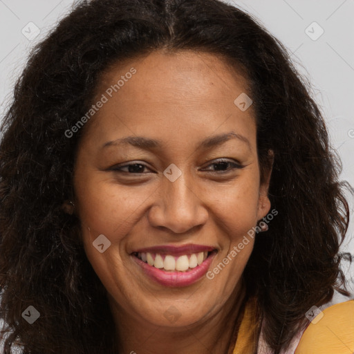 Joyful latino adult female with long  brown hair and brown eyes