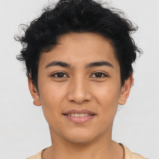 Joyful latino young-adult female with short  black hair and brown eyes