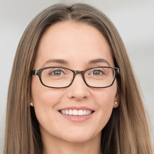 Joyful white young-adult female with long  brown hair and grey eyes