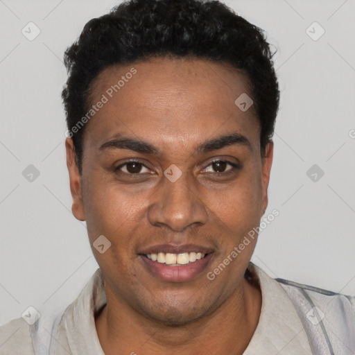 Joyful black young-adult male with short  black hair and brown eyes