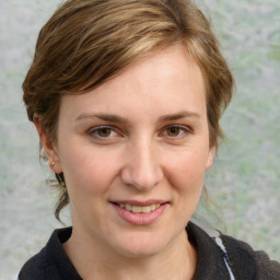 Joyful white young-adult female with medium  brown hair and blue eyes