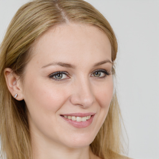 Joyful white young-adult female with long  brown hair and blue eyes