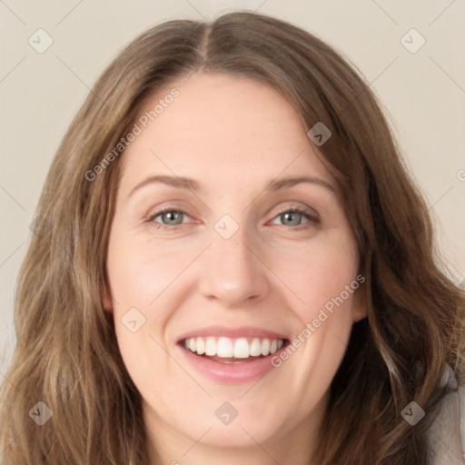 Joyful white young-adult female with long  brown hair and green eyes