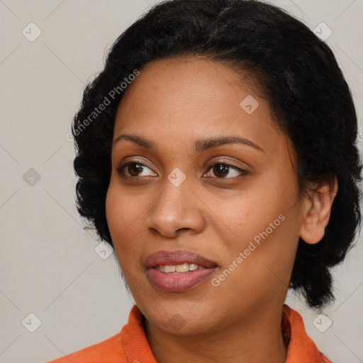 Joyful black young-adult female with medium  brown hair and brown eyes