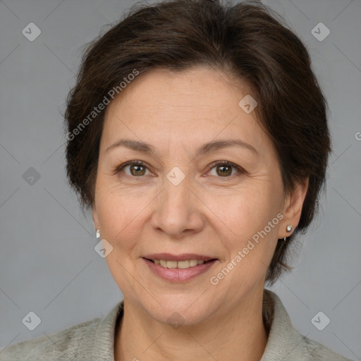 Joyful white adult female with short  brown hair and brown eyes