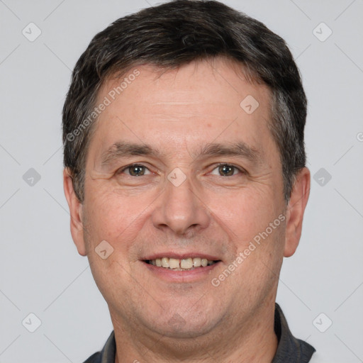 Joyful white adult male with short  brown hair and brown eyes