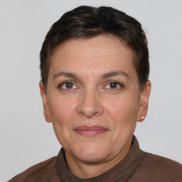 Joyful white adult female with short  brown hair and brown eyes