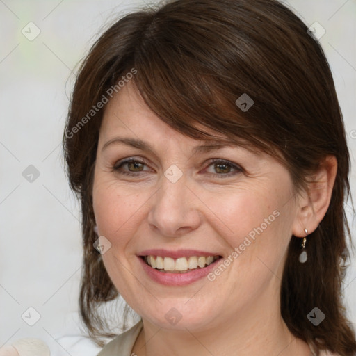 Joyful white adult female with medium  brown hair and grey eyes