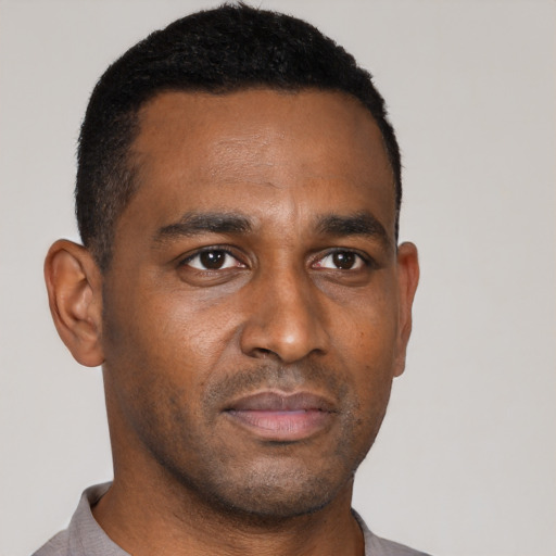 Neutral black young-adult male with short  black hair and brown eyes