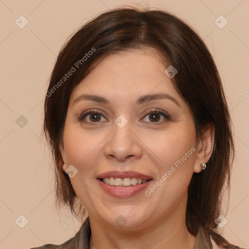 Joyful white adult female with long  brown hair and brown eyes