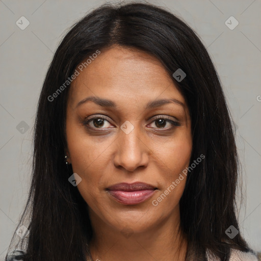 Joyful black young-adult female with long  brown hair and brown eyes
