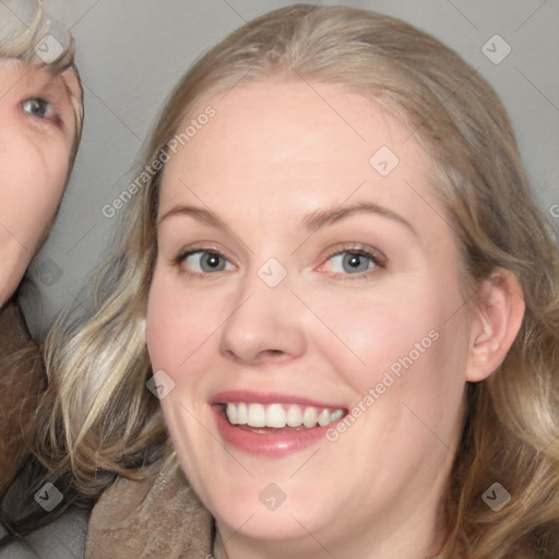 Joyful white adult female with medium  brown hair and blue eyes