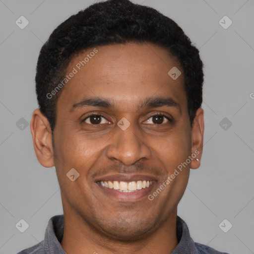 Joyful latino young-adult male with short  brown hair and brown eyes