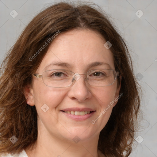 Joyful white adult female with long  brown hair and green eyes