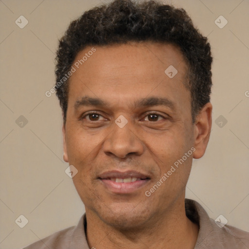 Joyful latino adult male with short  black hair and brown eyes