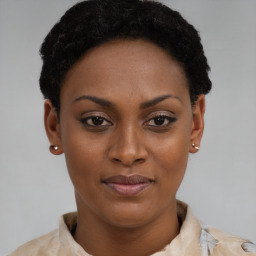 Joyful black young-adult female with short  brown hair and brown eyes