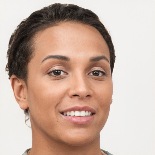 Joyful white young-adult female with short  brown hair and brown eyes