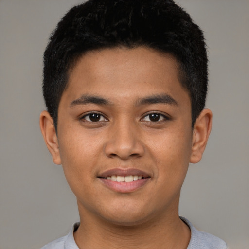 Joyful latino young-adult male with short  brown hair and brown eyes