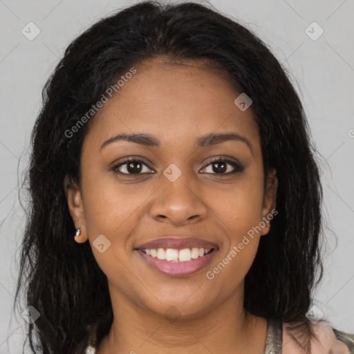 Joyful black young-adult female with long  brown hair and brown eyes