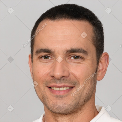 Joyful white young-adult male with short  brown hair and brown eyes