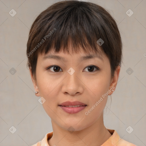 Joyful asian young-adult female with short  brown hair and brown eyes