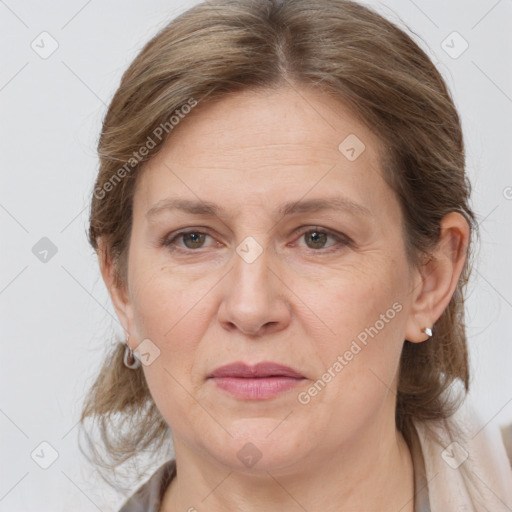 Joyful white adult female with medium  brown hair and grey eyes