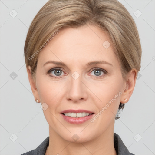 Joyful white adult female with short  brown hair and grey eyes