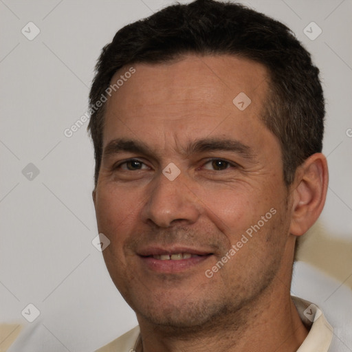 Joyful white adult male with short  brown hair and brown eyes