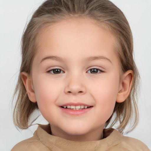 Joyful white child female with medium  brown hair and brown eyes