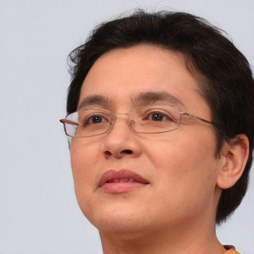 Joyful white adult female with short  brown hair and brown eyes