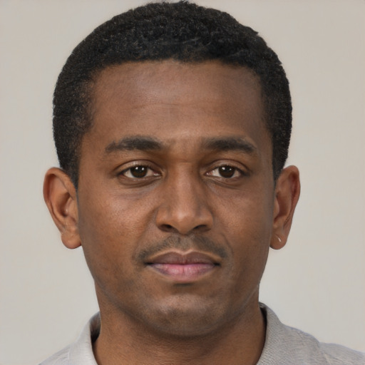 Neutral black young-adult male with short  black hair and brown eyes