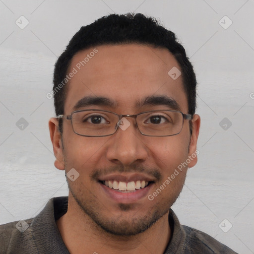 Joyful white young-adult male with short  black hair and brown eyes