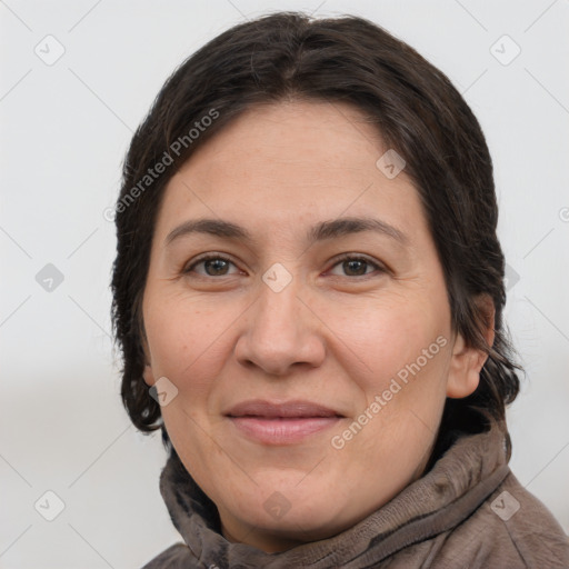 Joyful white adult female with short  brown hair and brown eyes