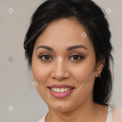 Joyful latino young-adult female with medium  brown hair and brown eyes