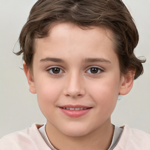 Joyful white child male with short  brown hair and brown eyes