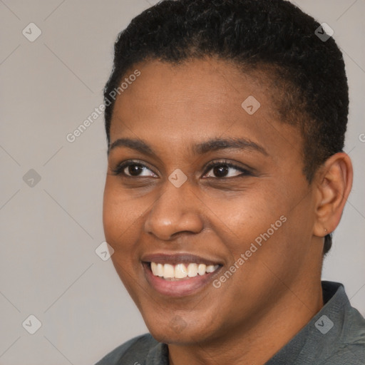 Joyful black young-adult female with short  brown hair and brown eyes