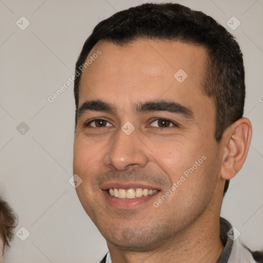 Joyful white young-adult male with short  brown hair and brown eyes