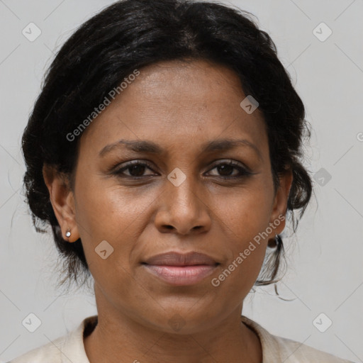 Joyful latino adult female with medium  brown hair and brown eyes