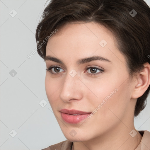 Neutral white young-adult female with short  brown hair and brown eyes