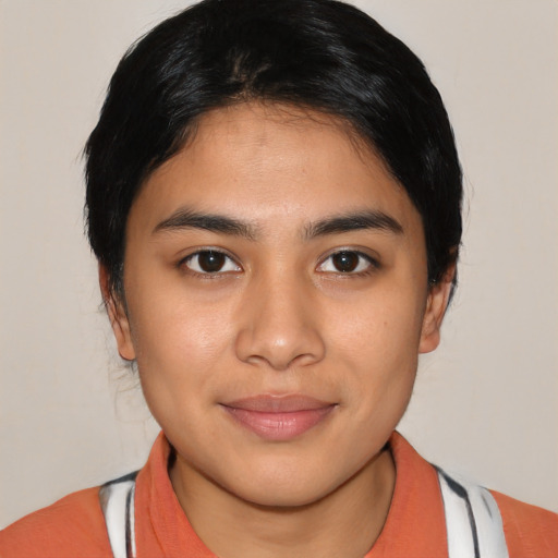 Joyful latino young-adult female with medium  black hair and brown eyes