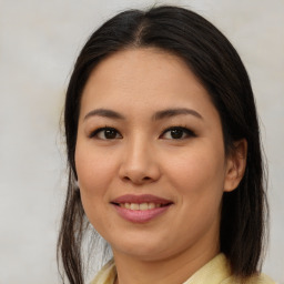 Joyful asian young-adult female with medium  brown hair and brown eyes