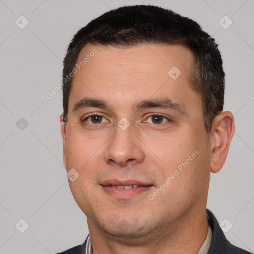 Joyful white young-adult male with short  black hair and brown eyes