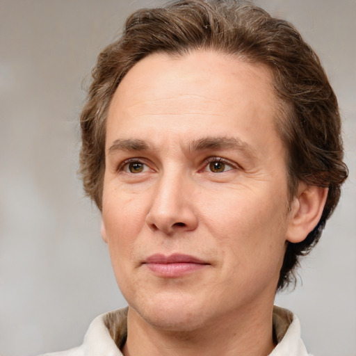 Joyful white adult male with short  brown hair and grey eyes