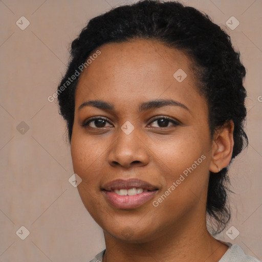 Joyful black young-adult female with long  brown hair and brown eyes