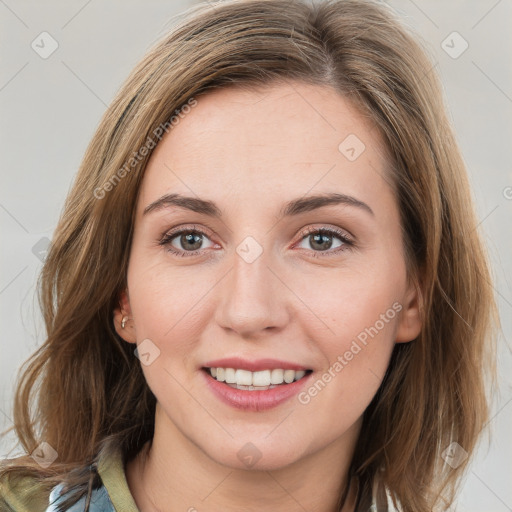 Joyful white young-adult female with medium  brown hair and blue eyes