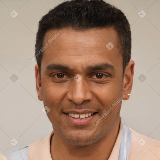 Joyful latino young-adult male with short  brown hair and brown eyes